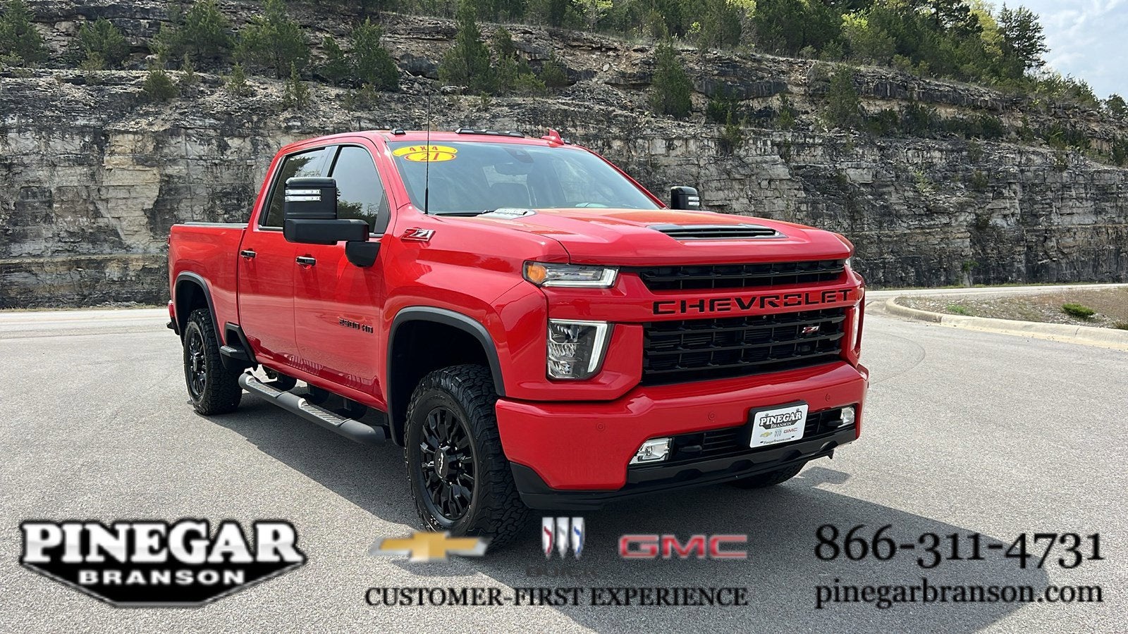 2021 Chevrolet Silverado 2500 HD LTZ in Red Hot — front three-quarter view