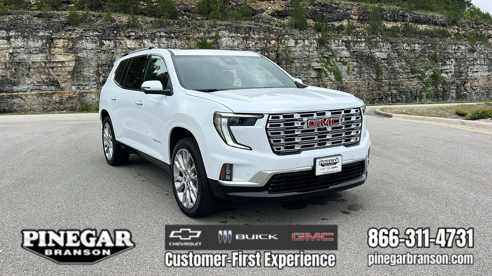 2026 GMC Acadia Denali in Summit White — front three-quarter view