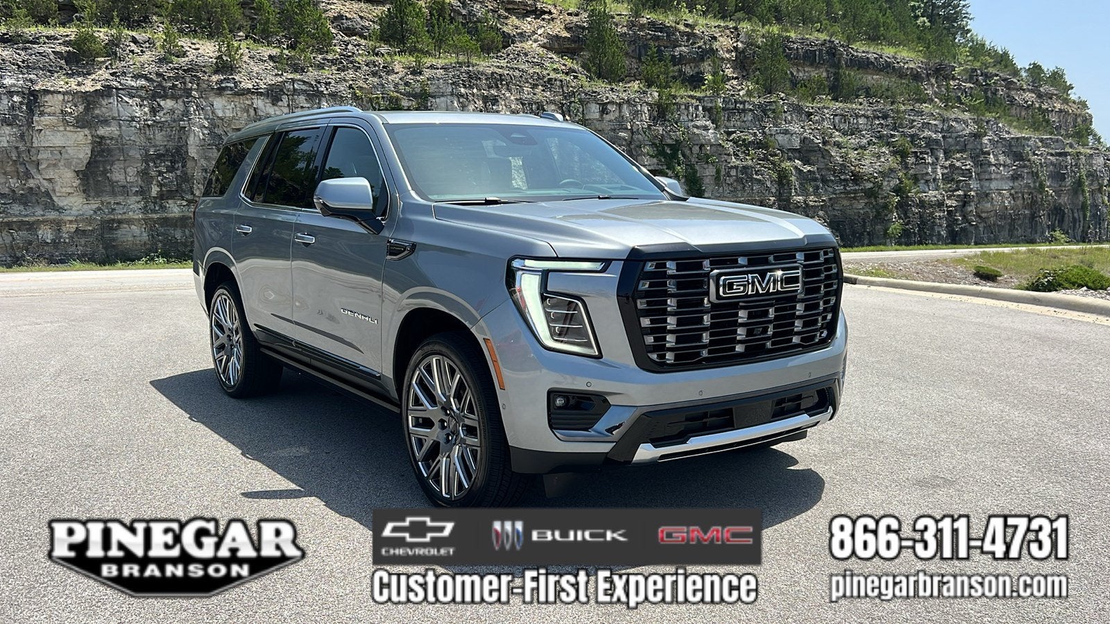 2026 GMC Yukon Denali Ultimate in Sterling Metallic — front three-quarter view