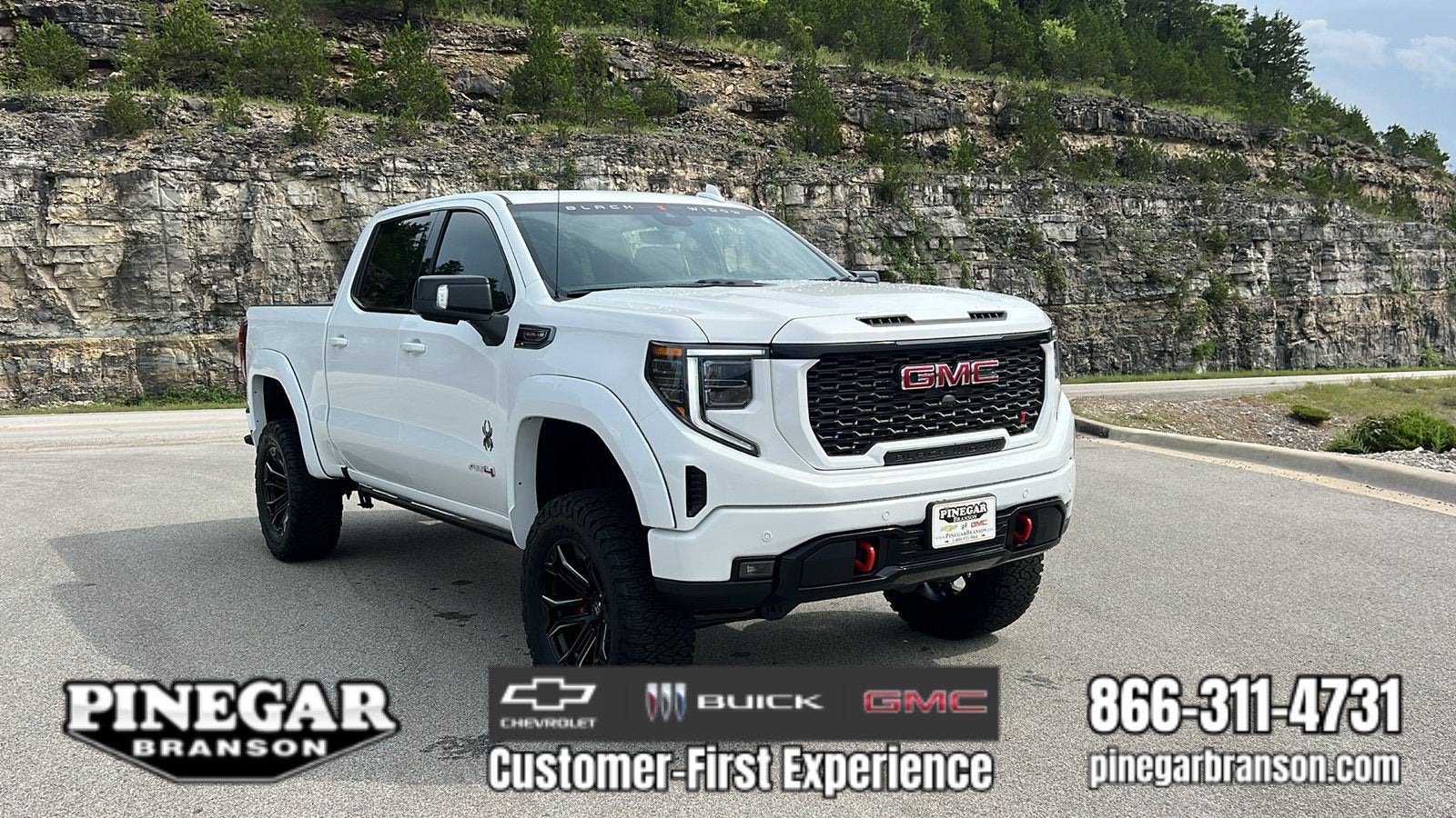 2026 GMC Sierra 1500 AT4 in Summit White — front three-quarter view