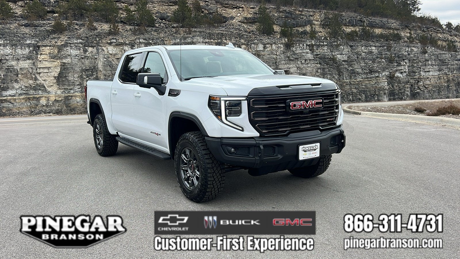 2026 GMC Sierra 1500 AT4X in Summit White — front three-quarter view