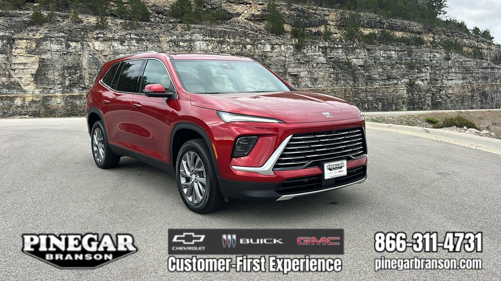 2026 Buick Enclave Preferred in Cherry Red Tintcoat — front three-quarter view