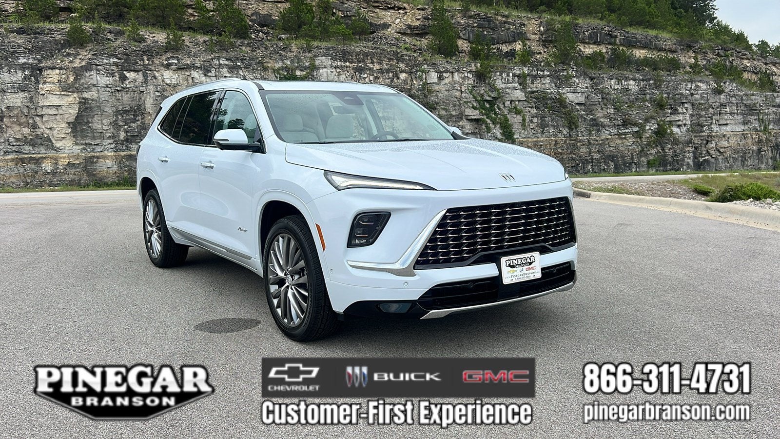 2026 Buick Enclave Avenir in Iridescent White Tricoat — front three-quarter view