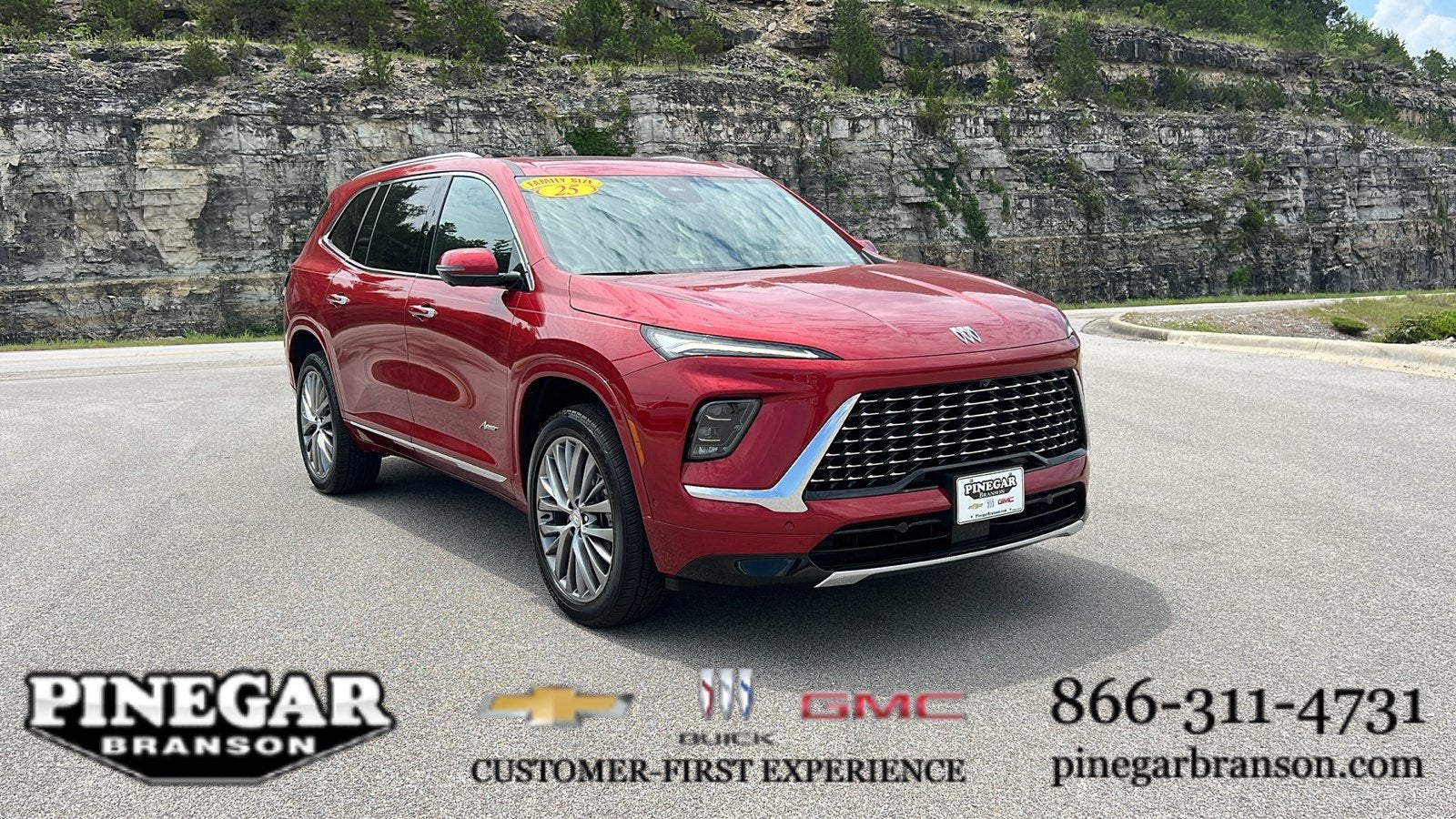 2025 Buick Enclave Avenir in Cherry Red Tintcoat — front three-quarter view